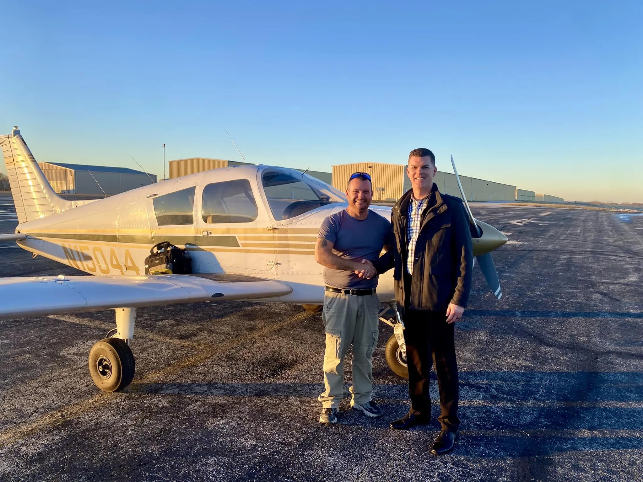 A future commercial pilot reviewing navigation charts before a flight lesson in Lee's Summit