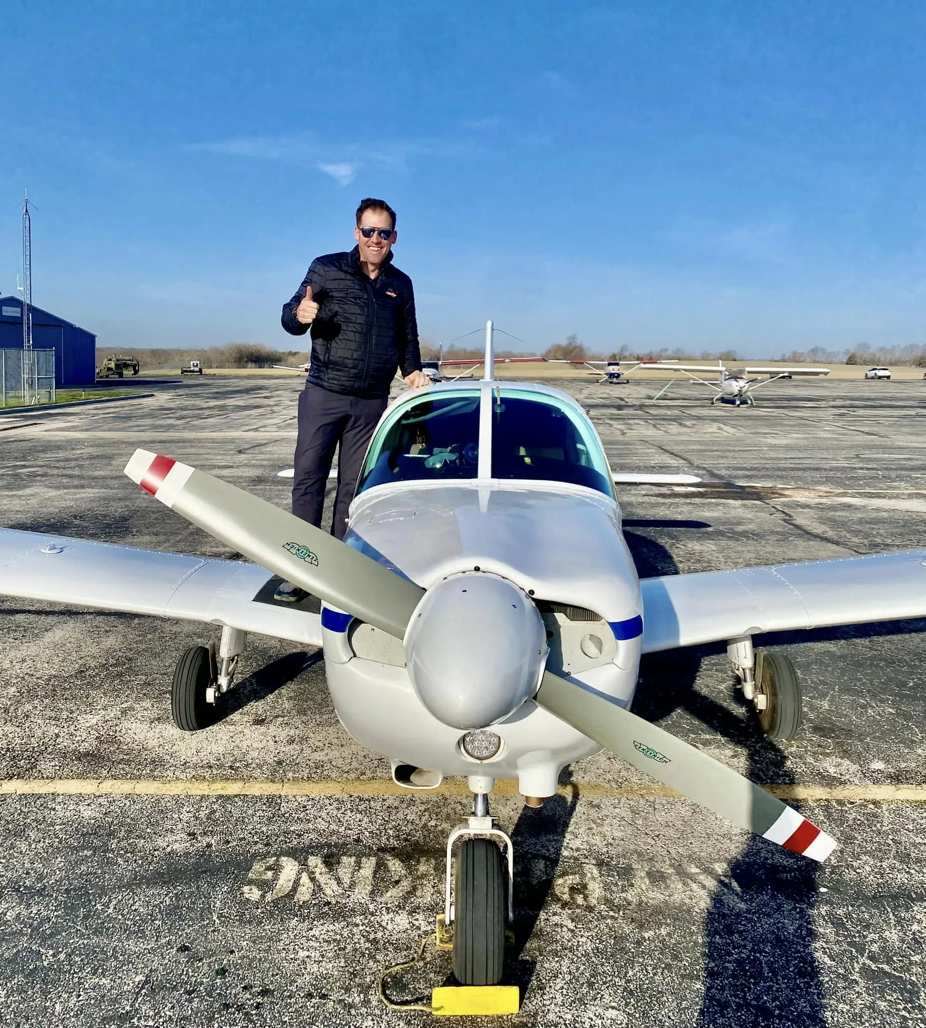 Student pilot and flight instructor reviewing charts and training materials during commercial training at Summit Flight Academy