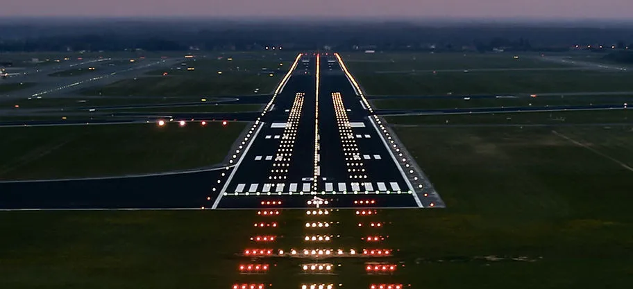 Runway and approach lighting seen from the final approach at dusk