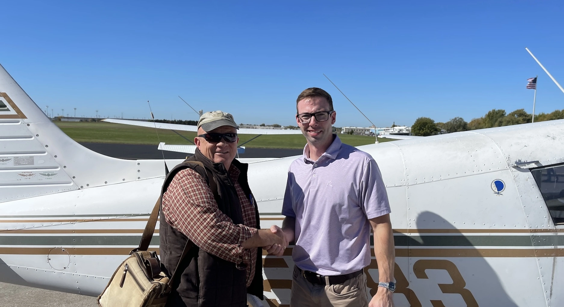 Student and flight instructor standing next to a Piper Cherokee at Lee's Summit Airport during Career Track training