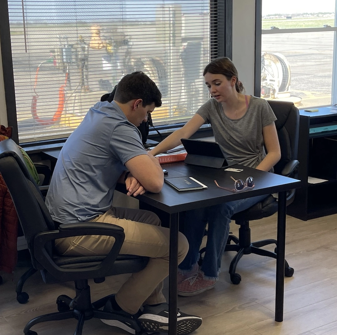 Certified Flight Instructor and student during an in office study session