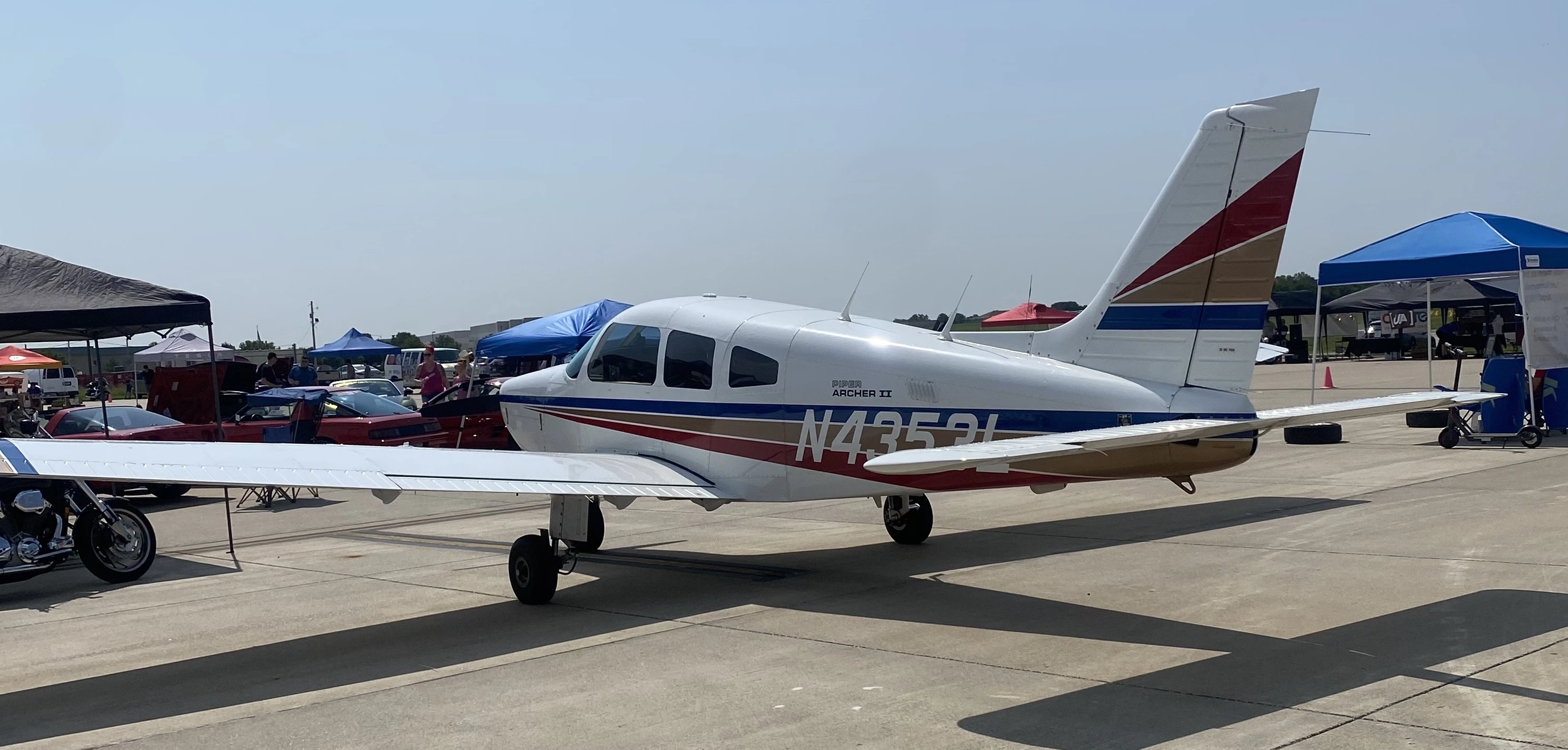 Piper Archer II N4353L parked on the ramp at an airport event